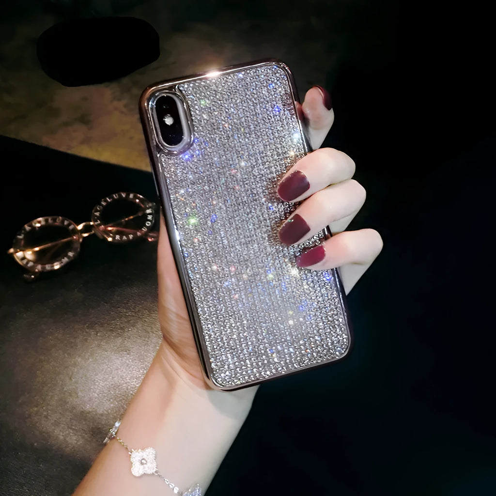 Silver silicone full diamond phone case for iPhone on a table