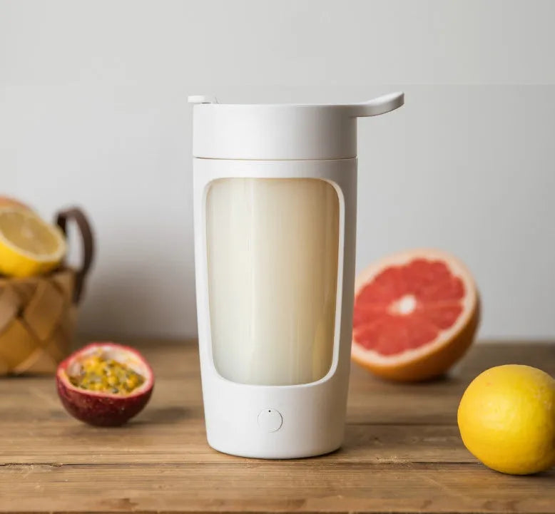 Portable rechargeable juice blender in white with 650ml mixing cup and compact dimensions.