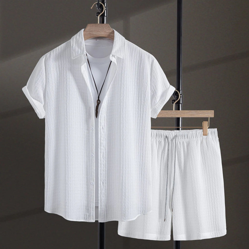 Men's white cotton blend jacquard shirt and matching shorts casual suit set laid flat.