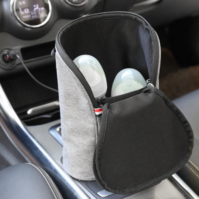 Grey portable baby bottle warmer with electronic display, car charger, and buckle for hanging on prams