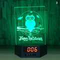 Glowing blue dolphin-shaped 3D LED night light on a table with wireless charging base