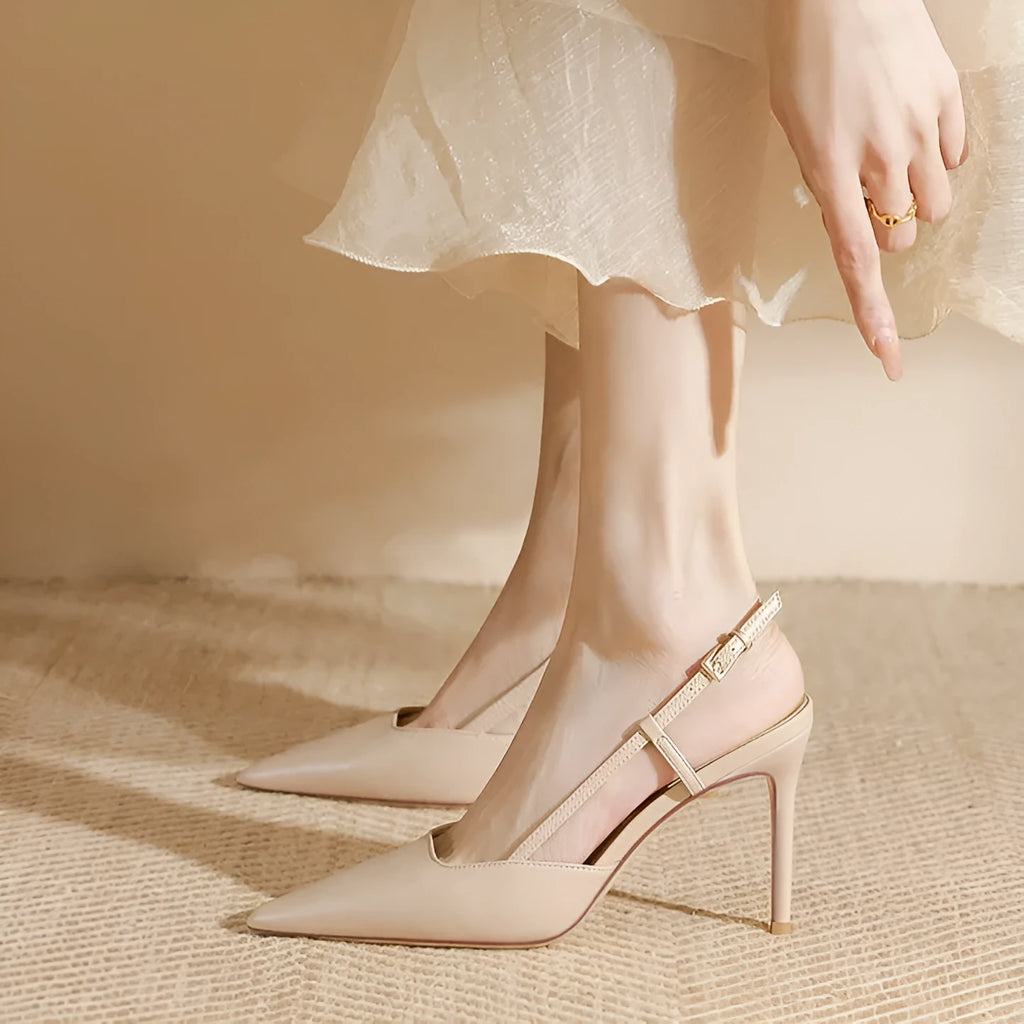 Apricot women's high-heeled sandals with a single thin strap and buckle fastening, shown on a foot.