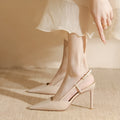 Apricot women's high-heeled sandals with a single thin strap and buckle fastening, shown on a foot.
