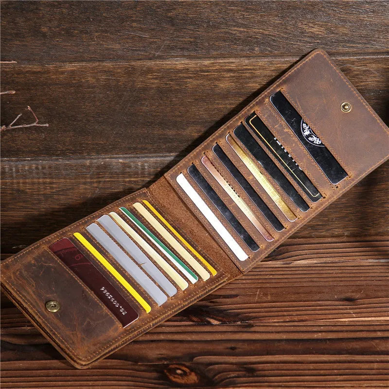 Men's long cowhide leather wallet showing card slots, money pocket, and mobile phone compartment.