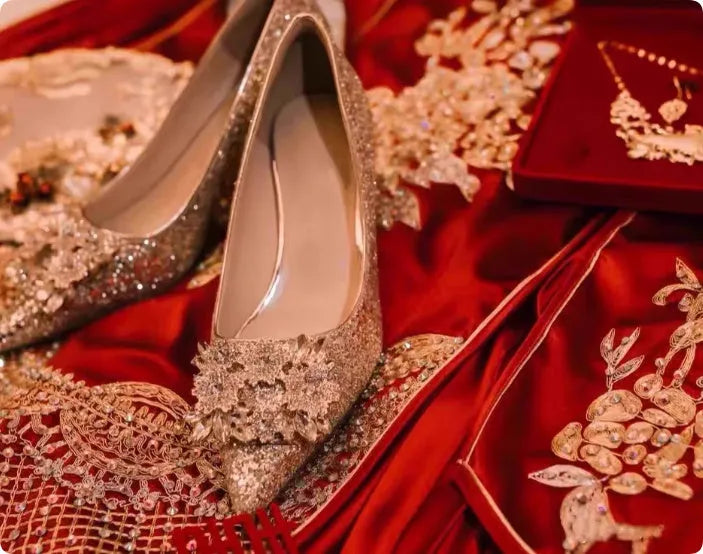 Champagne Xiuhe wedding shoes with rhinestone flower pattern and pointed toe on a fine heel.