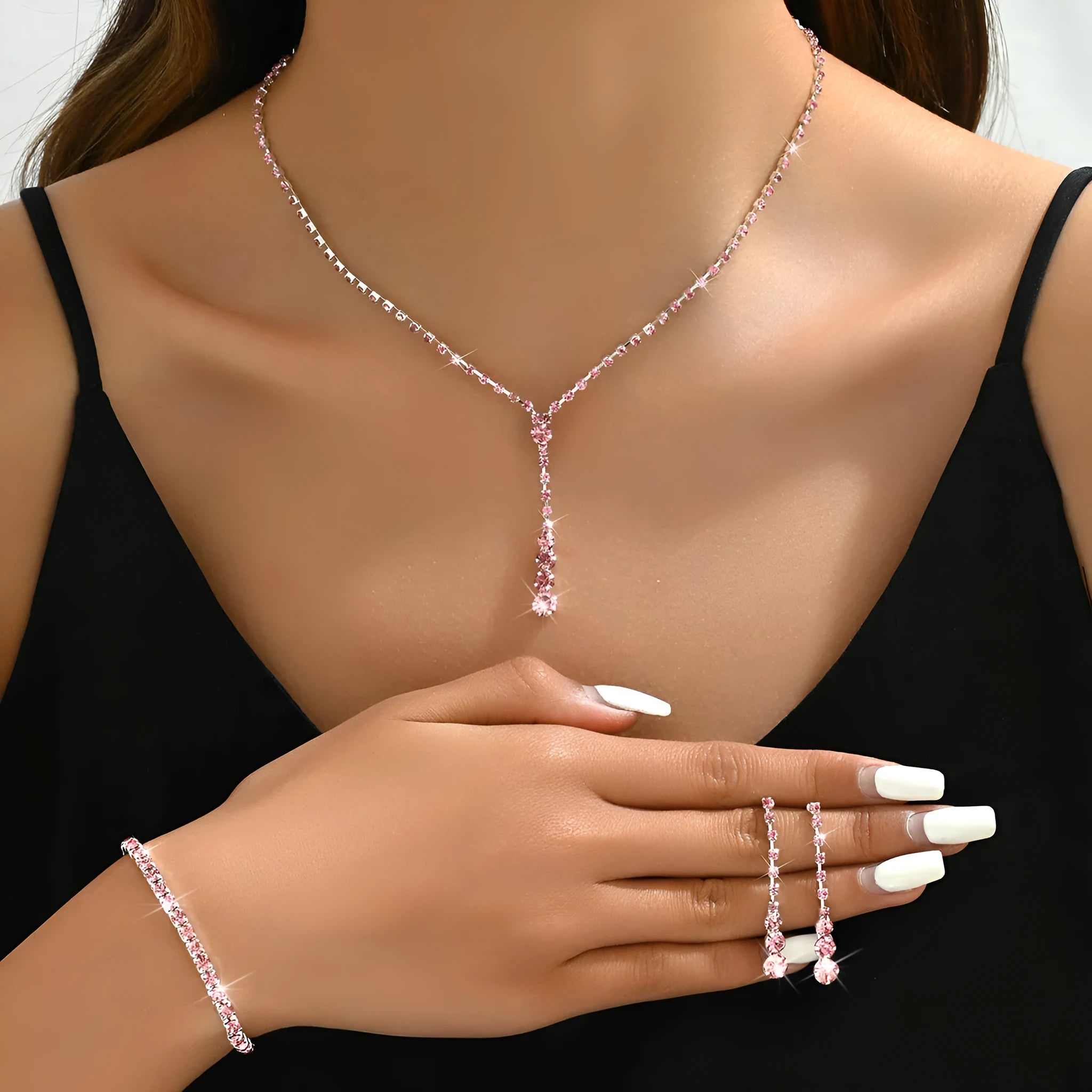 Women's rhinestone wedding jewellery set with heart pendants and tassel details in silver, rose gold, black, or pink