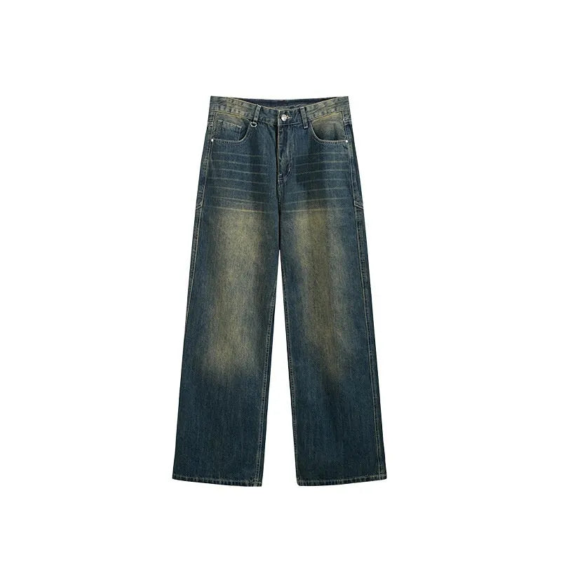 Man wearing washed vintage blue wide leg jeans with a straight leg and mid-waist cut