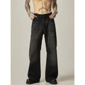Black loose straight leg jeans with inelastic denim fabric and zipper fly closure