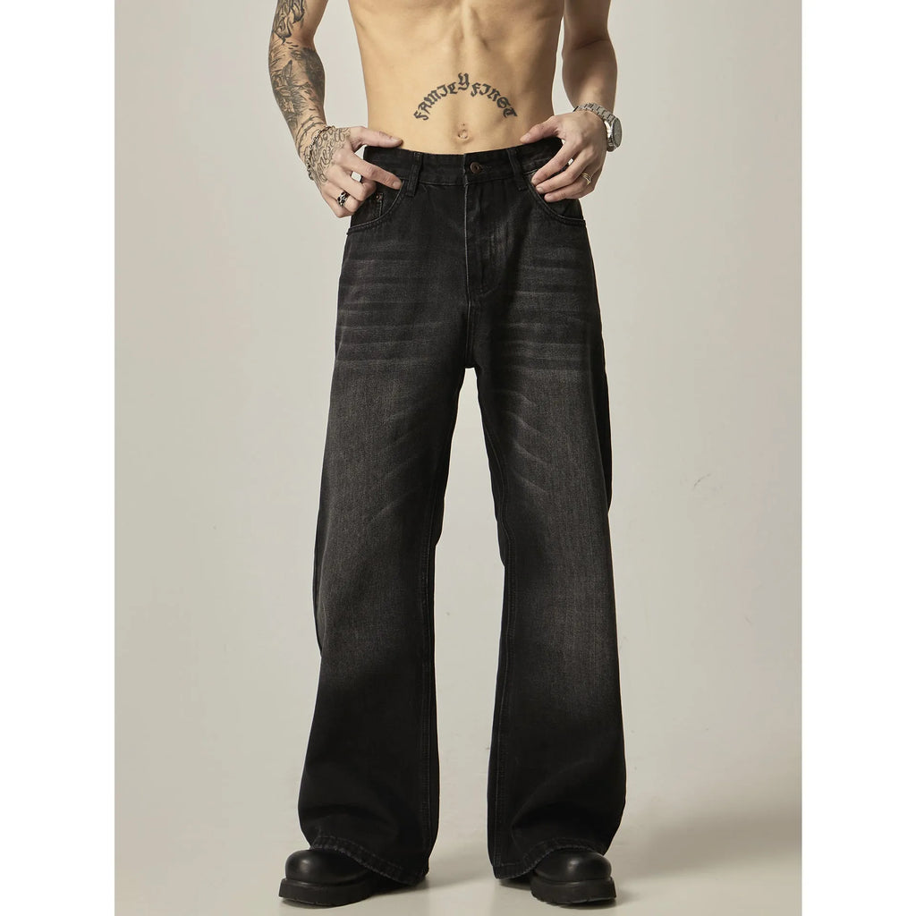 Black loose straight jeans with zipper fly, inelastic denim fabric, retro styling, shown flat and on model