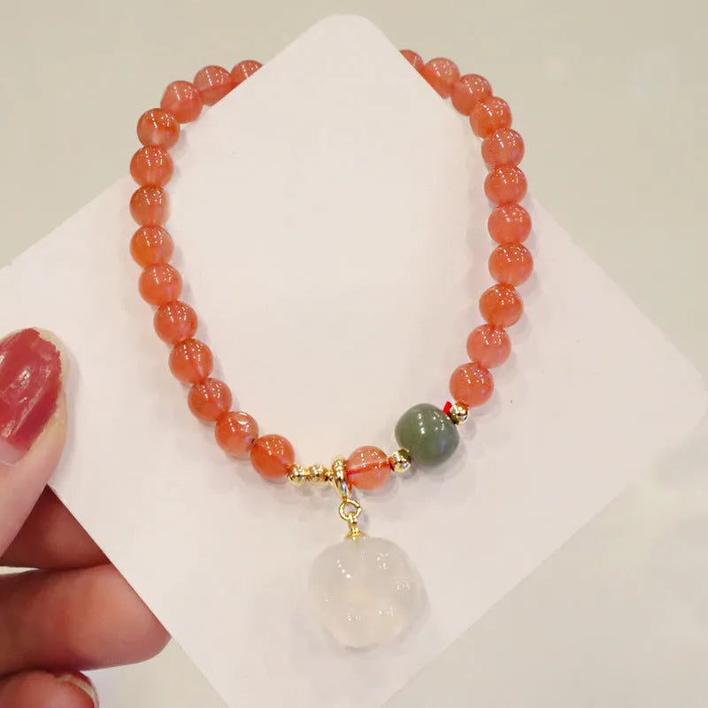 Women's natural red agate and jade bracelet set with cat paw detail on 8mm beads
