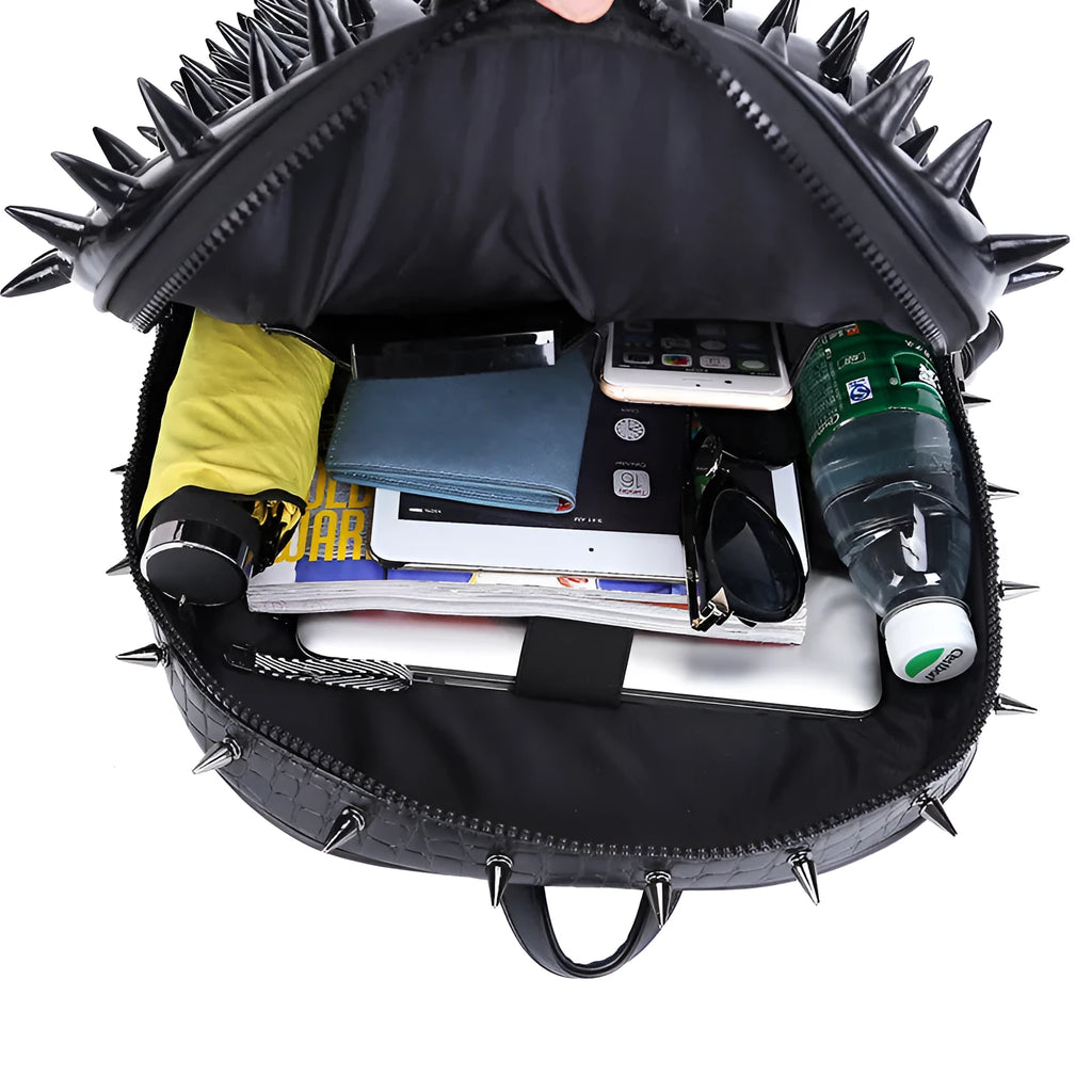 Black oval women's punk style backpack made of PU leather with hollow out details and air cushion straps.