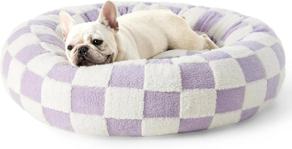 Round plastic dog bed with a blue and white plaid removable cover, shown in a 60x60cm size.