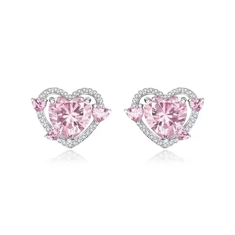Women's white gold tone heart stud earrings with electroplated copper construction