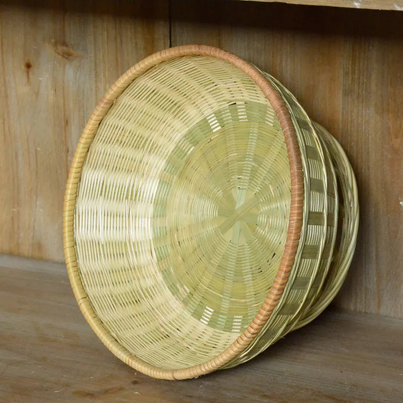 Handmade bamboo storage basket showing woven construction with three size options for household organisation