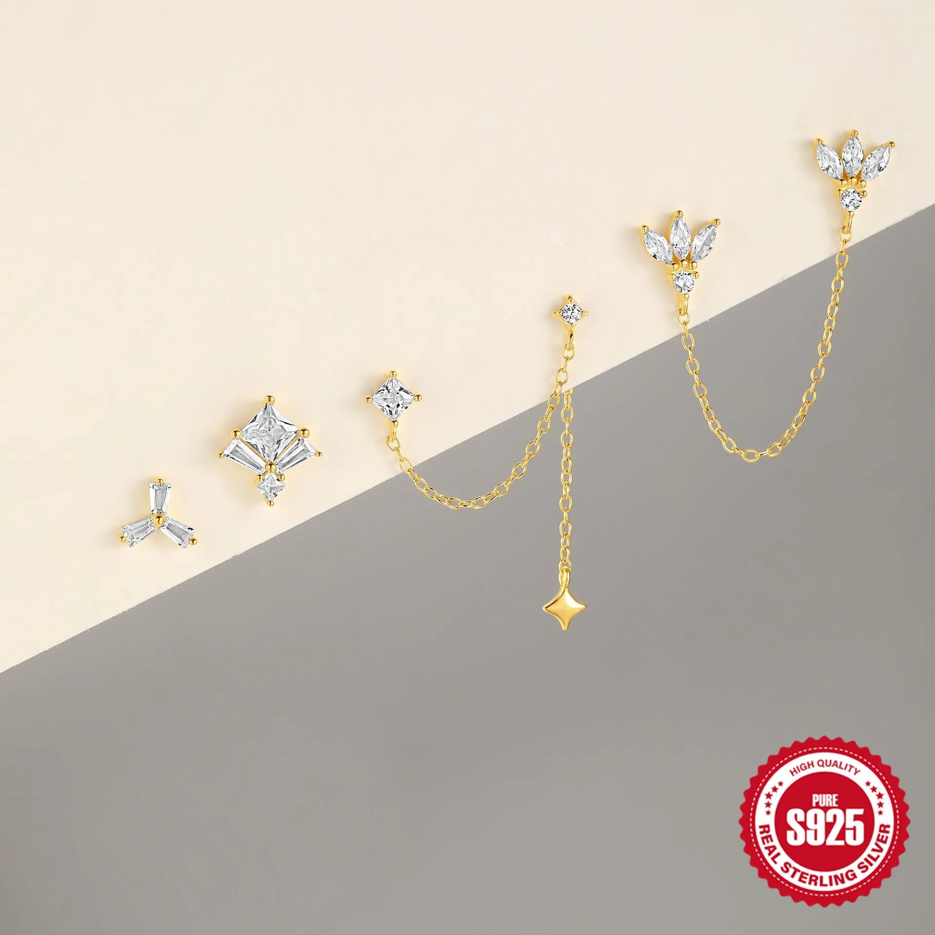 S925 sterling silver earrings with golden finish and inlaid zircon in geometric shapes including clover and crown designs