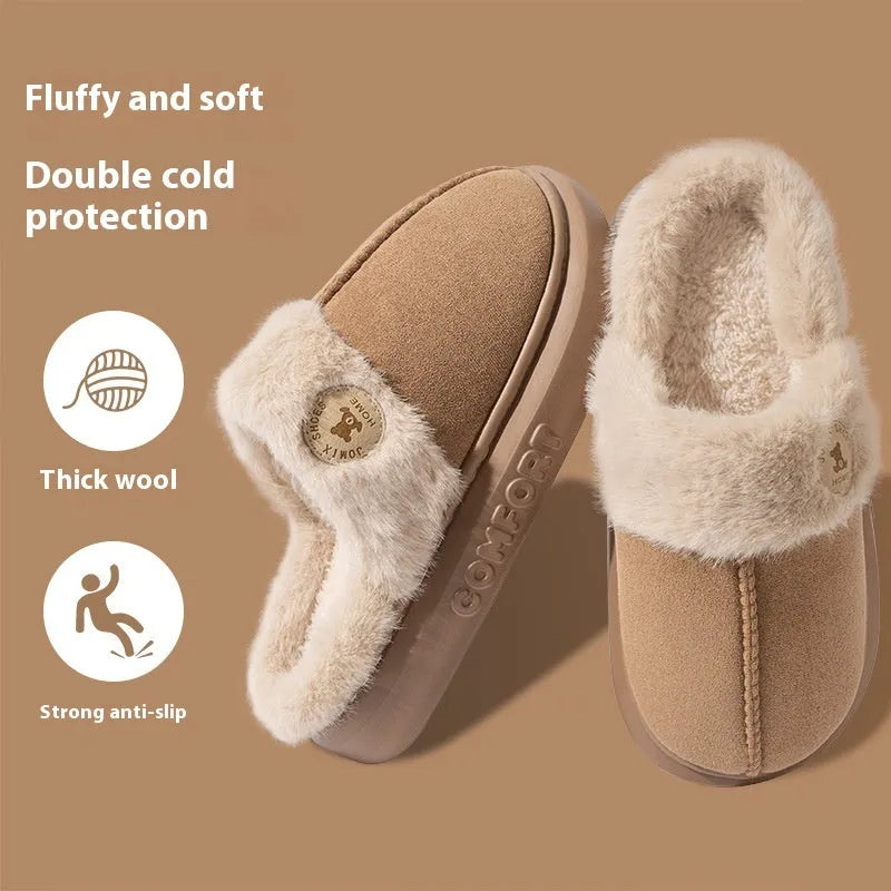 Plush slippers in black with fleece lining and non-slip PVC soles, shown on a wooden floor