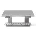 Aluminium alloy laptop stand in black or silver on a desk, showing its raised platform design.