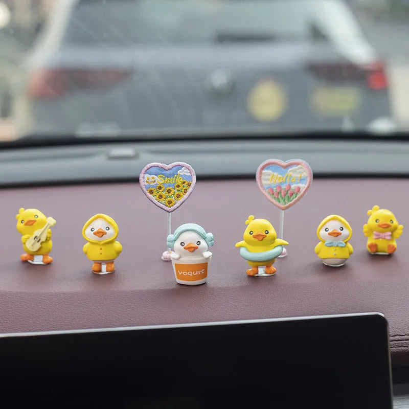 PVC duckling car interior decoration set with six small ducks and one sign on car dashboard