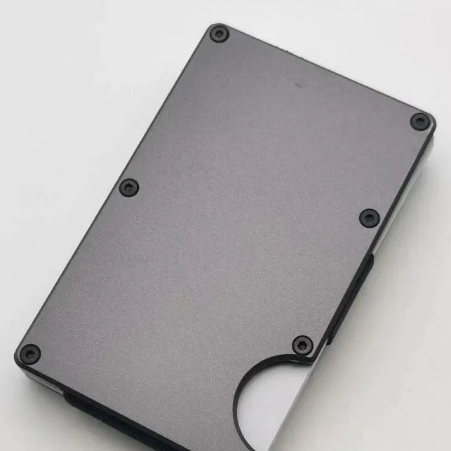 Carbon fibre credit card wallet in aluminium alloy grey with anti-theft RFID blocking, holding seven cards