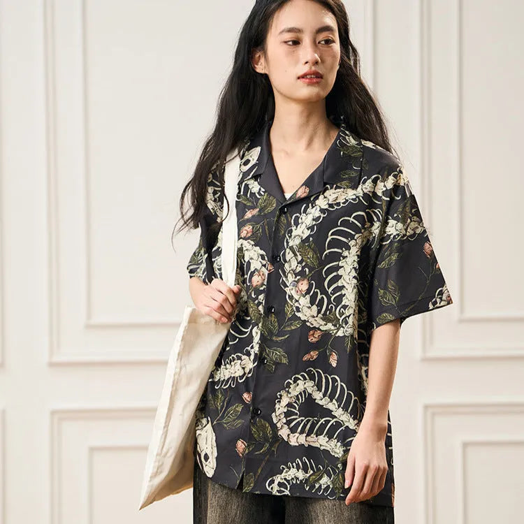 Snake bone floral pattern printed on light blue polyester Cuban collar shirt with short sleeves
