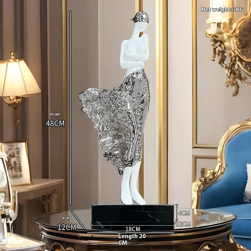 48cm tall sculptured character ornament in natural resin with rose gold finish on wooden surface