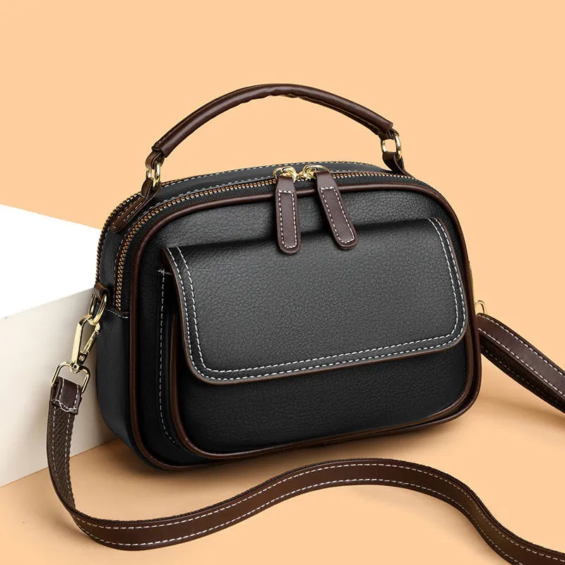 Women's square cross-body shoulder bag in black, green, or orange with double shoulder straps