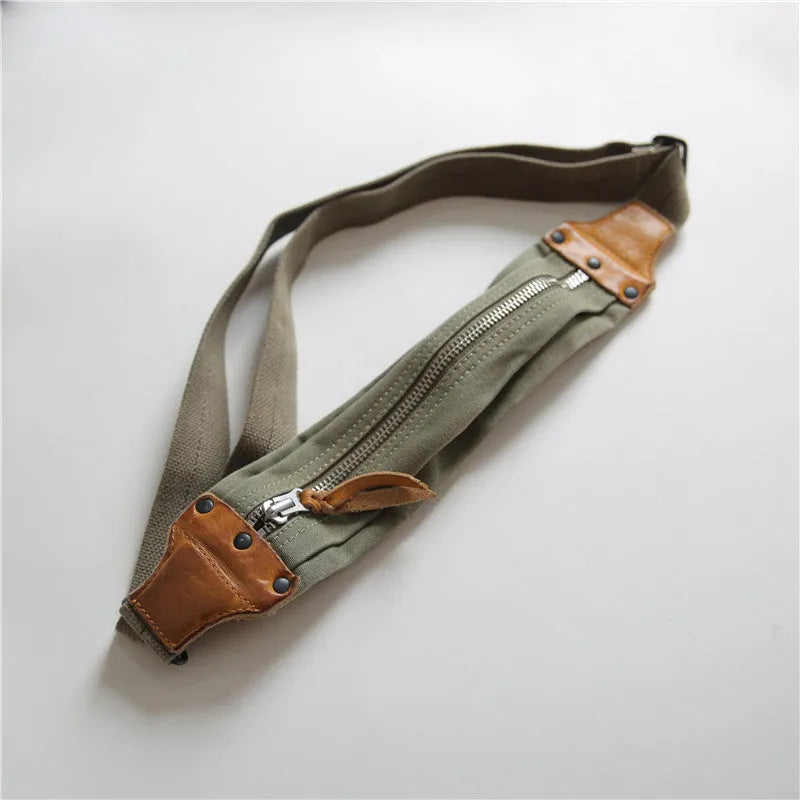 Green military style chest bag made from vintage canvas with cowhide leather accents and anti-theft design