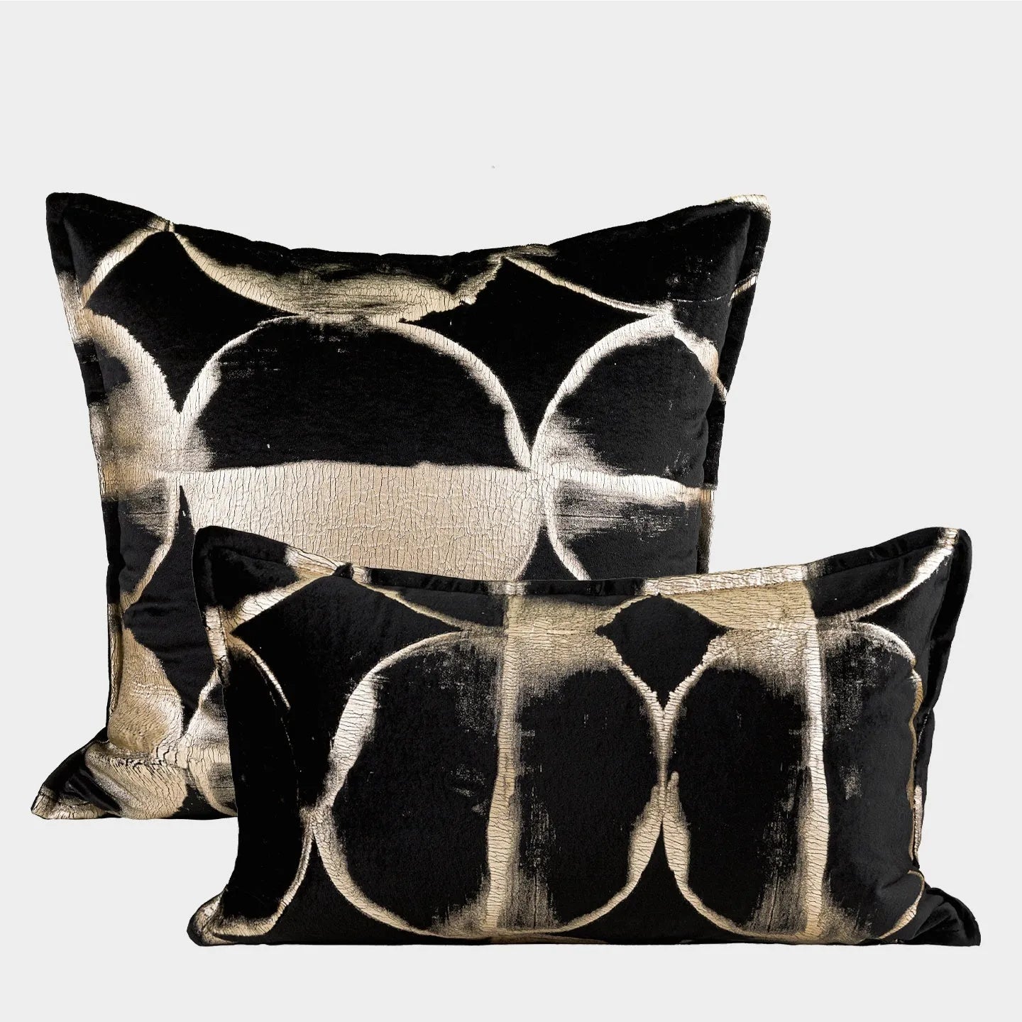 Black gold abstract pattern cushion with removable cover in three size options on furniture