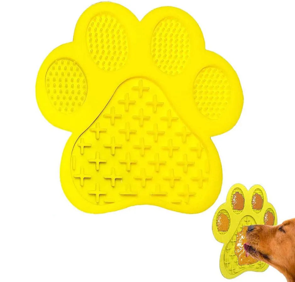 Blue silicone dog licking mat with suction cups on a tile surface, showing bone-shaped texture