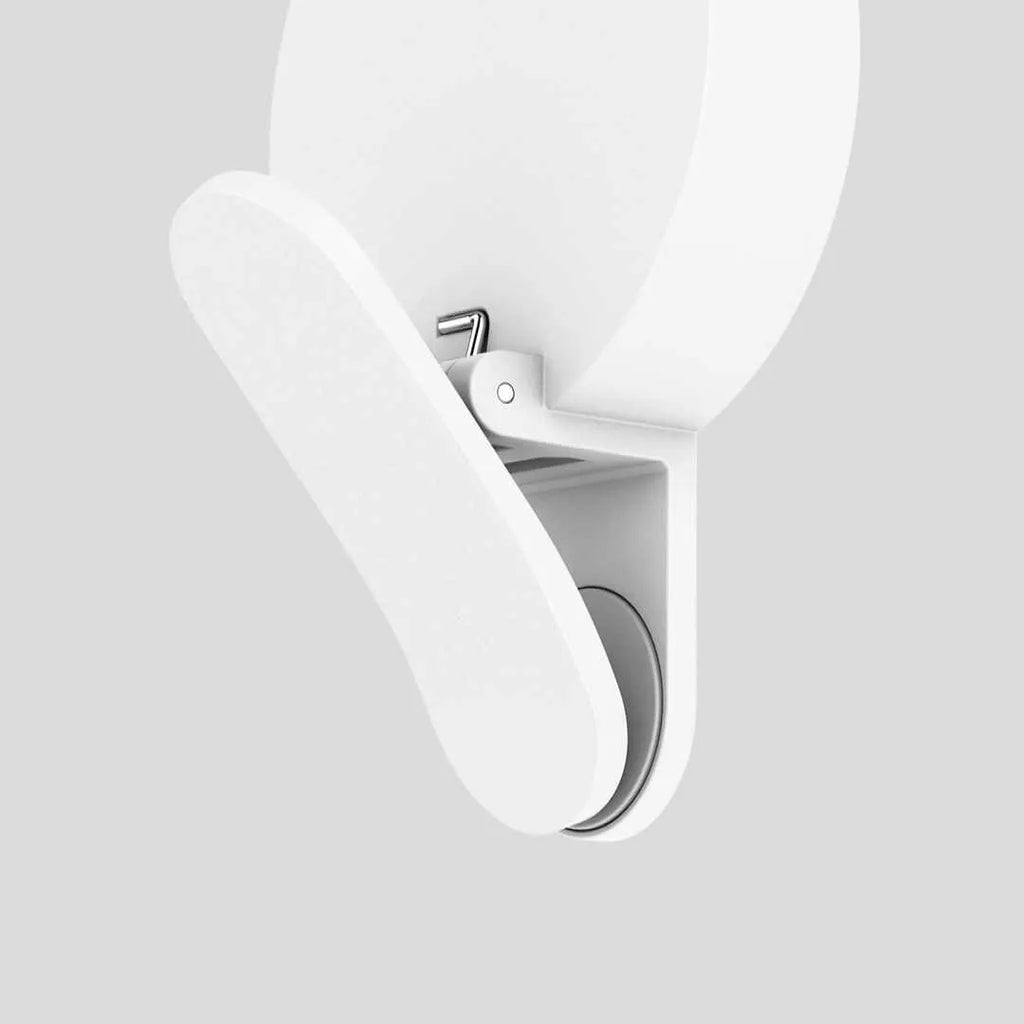White clip-on LED selfie light for mobile phones showing three-level dimming buttons and USB port.