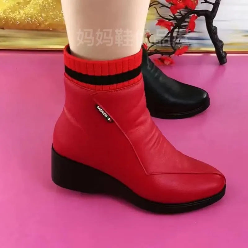 Pair of women's mid heel square heel ankle boots with side zipper and artificial plush lining in black or red