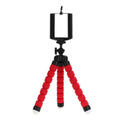 Black mini flexible octopus tripod stand wrapped around a pole holding a smartphone for video recording