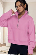 Women's loose fit lapel sweater with fleece lining and long raglan sleeves in a solid colour.