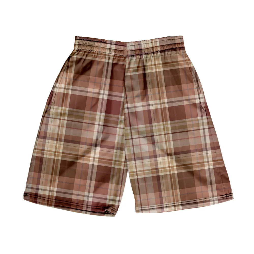 Man wearing grey plaid casual shorts with an elastic waistband, on a beach.