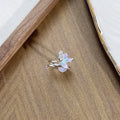 Adjustable copper insect ring showing detailed modelling and dripping oil colour treatment on finger