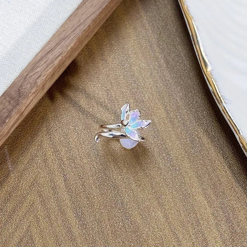 Adjustable copper insect ring showing detailed modelling and dripping oil colour treatment on finger