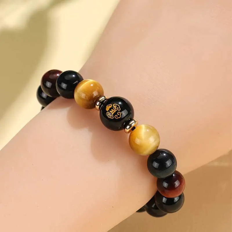 Handmade black agate beaded bracelet with tiger eye stones and Buddhist deity zodiac charms