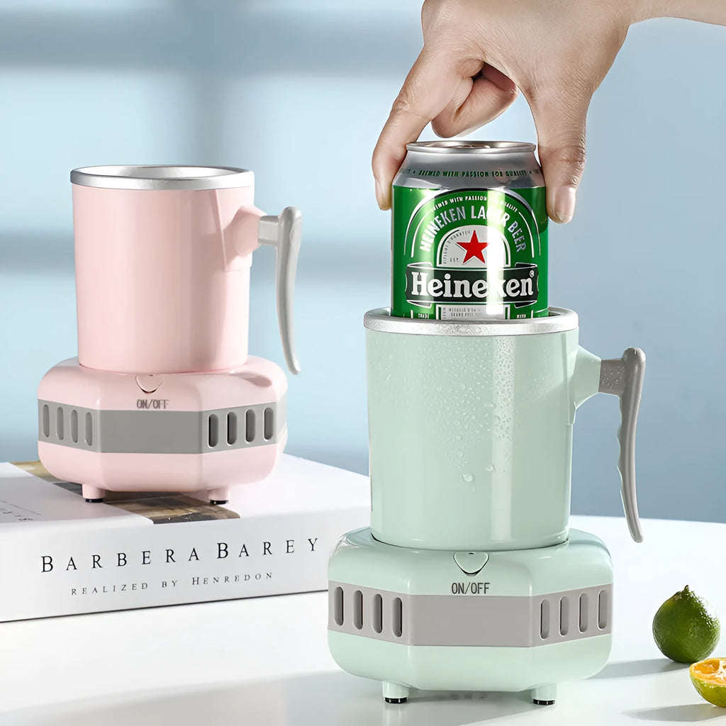 White portable aluminium quick-cooling cup and base on a desk next to a coffee mug.