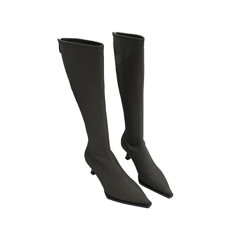 Women's black below-the-knee boots with pointed toe, stiletto heel, and back zipper