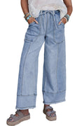 Beau blue wide leg denim pants with drawstring waist and raw hem detail laid flat