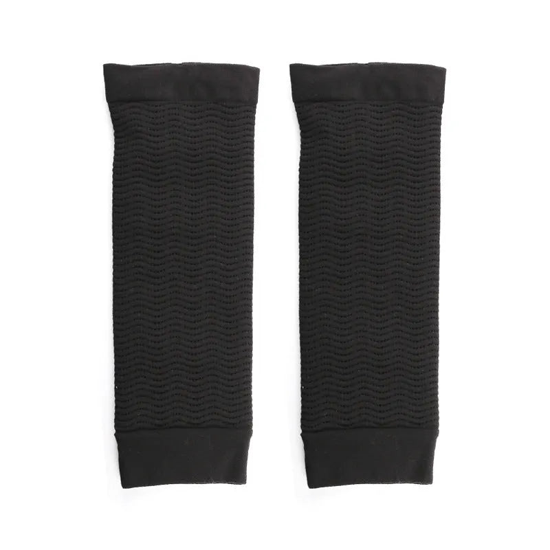 Women's black nylon compression arm sleeves showing free size design