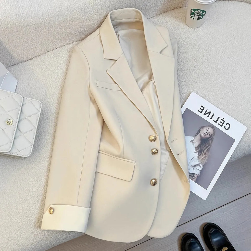 Women's Korean-style coat in solid colour with loose fit, 65cm length, and pockets for commuting wear.