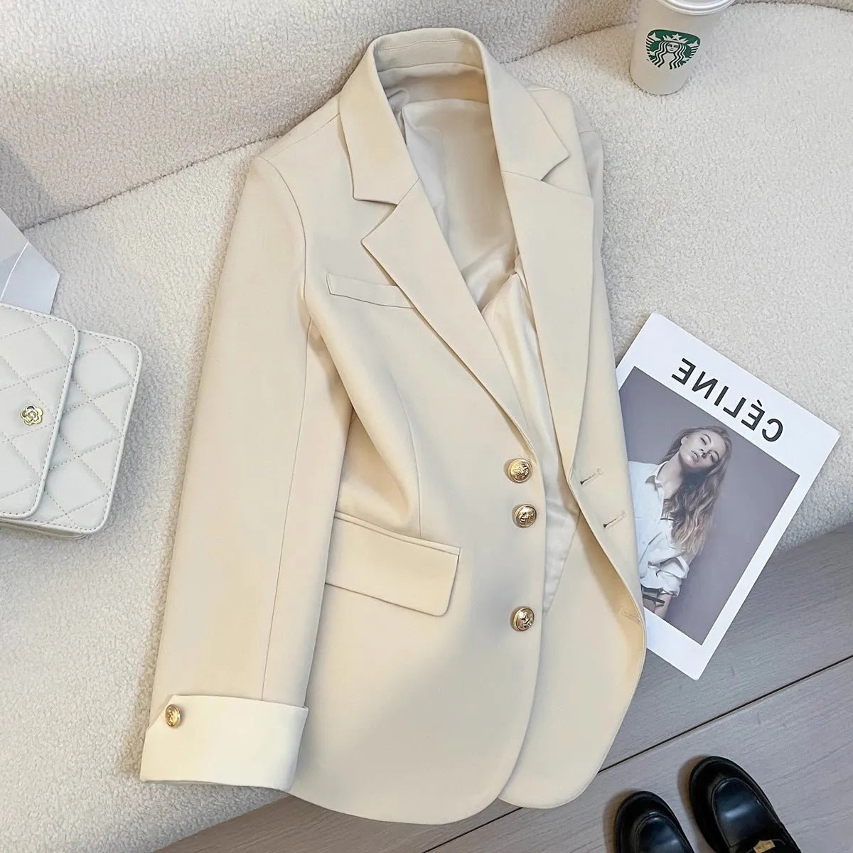 Women's Korean-style coat in solid colour with loose fit, 65cm length, and pockets for commuting wear.