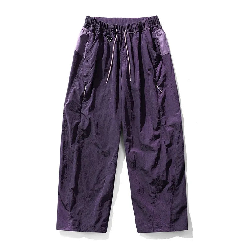 Fleece-lined quick-dry paratrooper cargo pants in army green with cargo pockets and adjustable ankle cuffs.