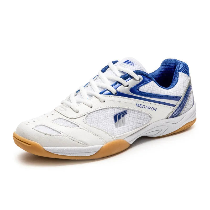 White and red table tennis sneakers with synthetic leather upper and lace-up front.