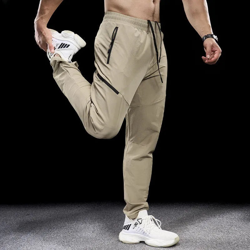 Men's waterproof quick-dry nylon workout trousers in multiple colours for sports and fitness activities