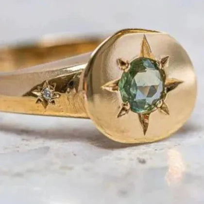 Golden adjustable ring with oval asterism zircon centre and micro inlay star pattern on zinc alloy band