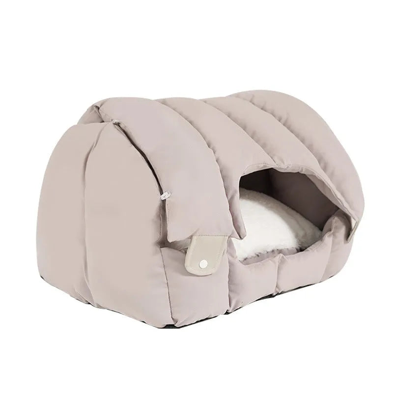 Dual-purpose arched pet bed showing enclosed cat nest section and open sofa-style area