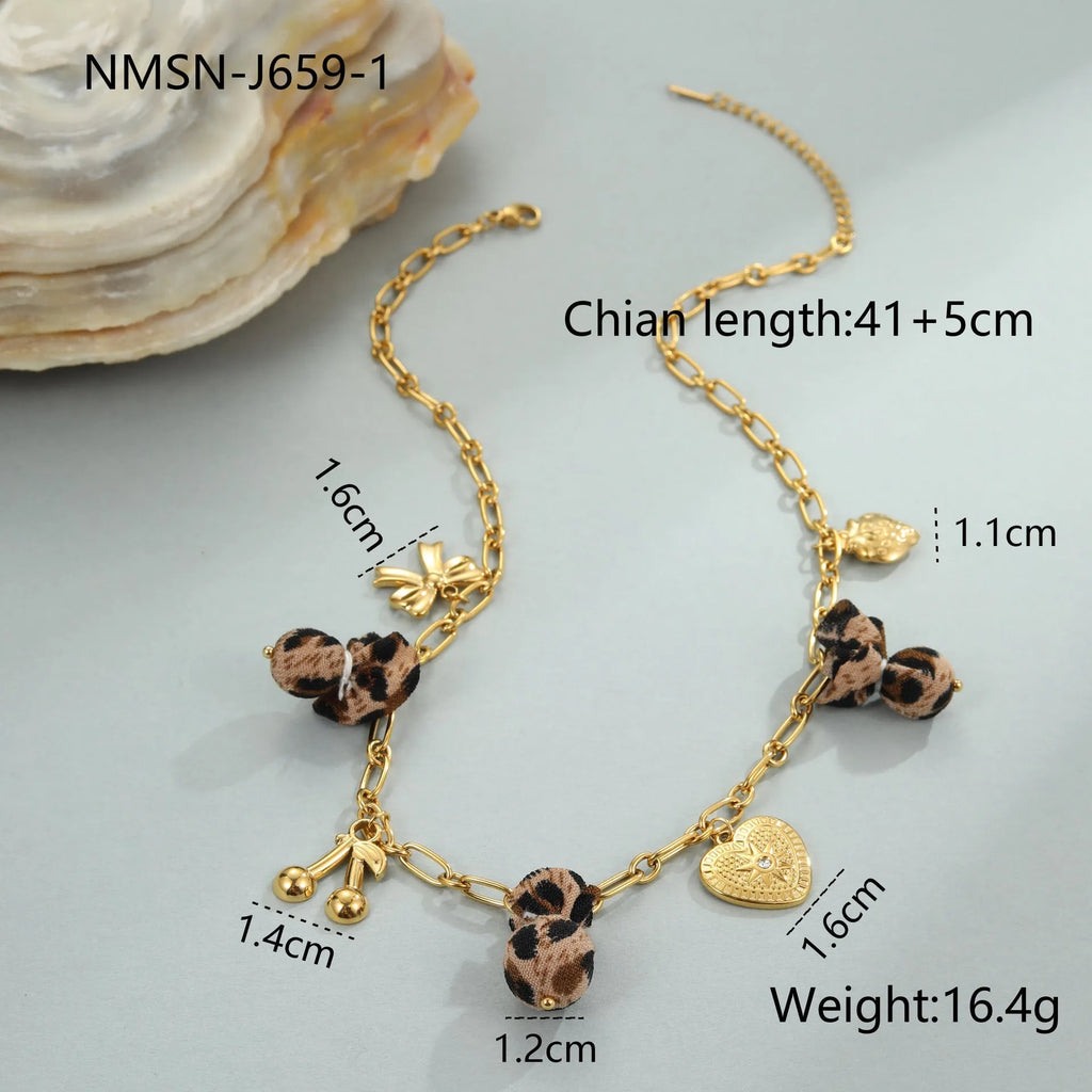 Women's gold-plated stainless steel necklace with leopard, love heart, and flowers pendant on an adjustable chain.