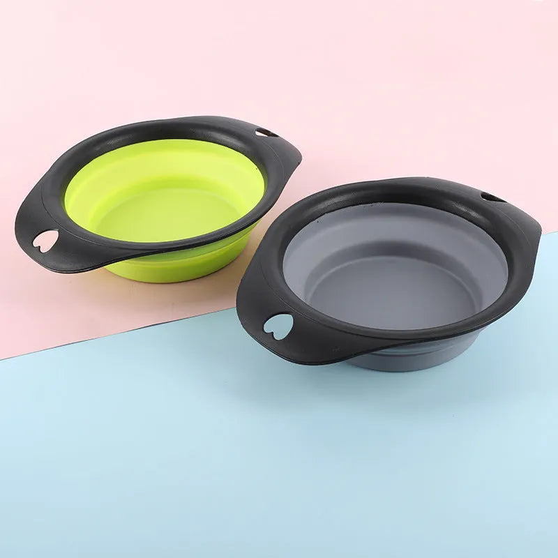 Black and green silicone pet bowls shown folded flat and unfolded ready for use.